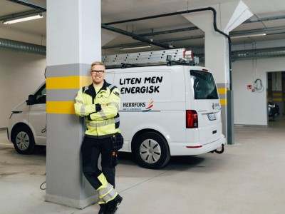 Martin standing in front of company vehicle